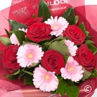 6 large headed red roses mixed with 6 pink mini gerbera bound together with foliage